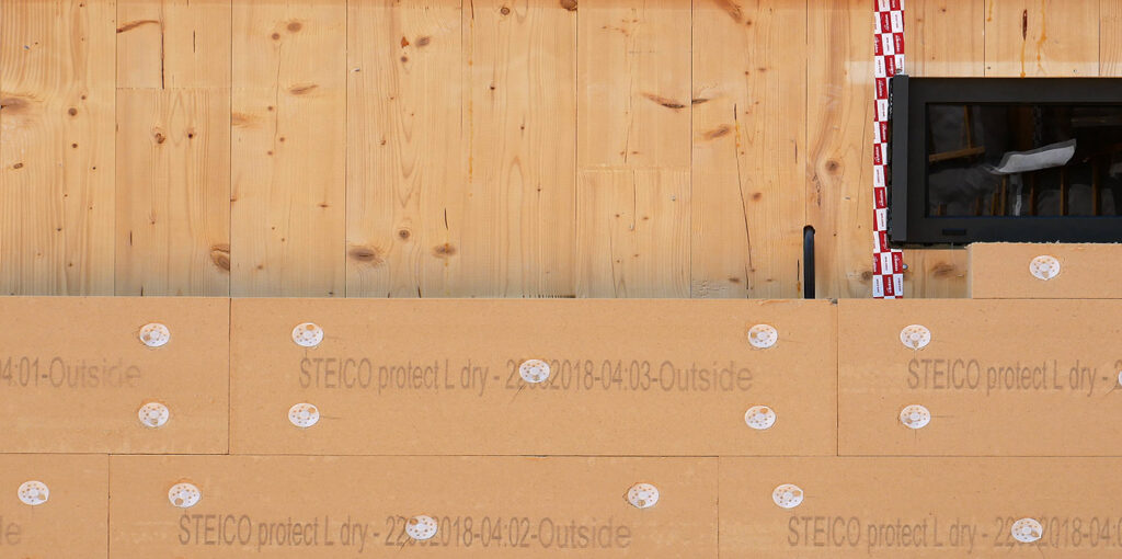 Aïllant de fibra de fusta a sobre de CLT
