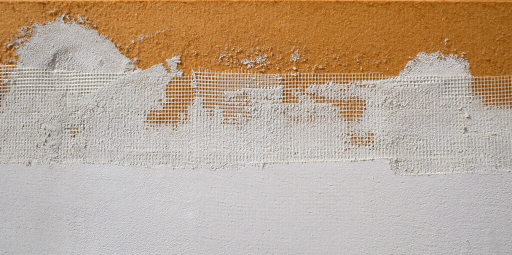 Malla de reforç i emprimació de fons